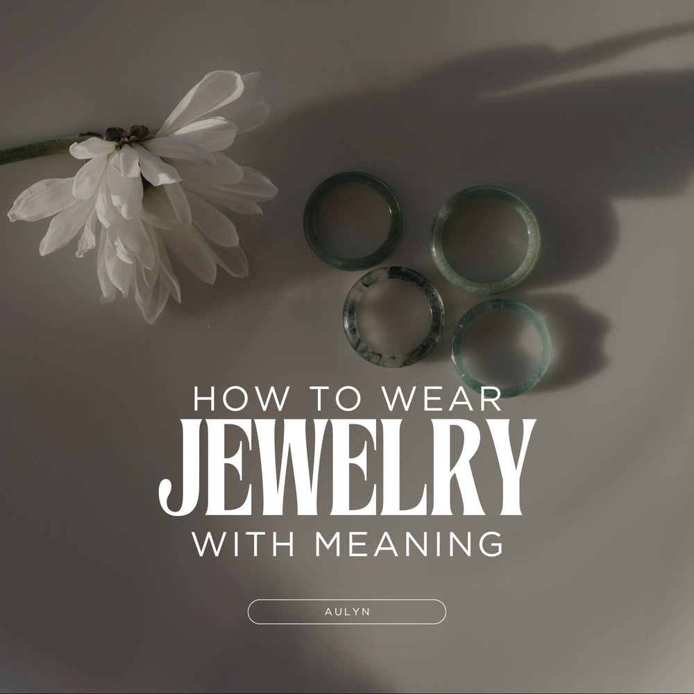 Jade rings in a plate next to a flower