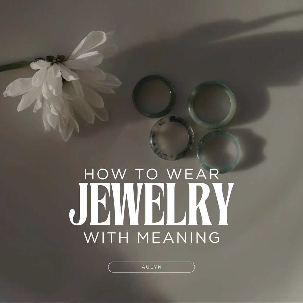 Jade rings in a plate next to a flower
