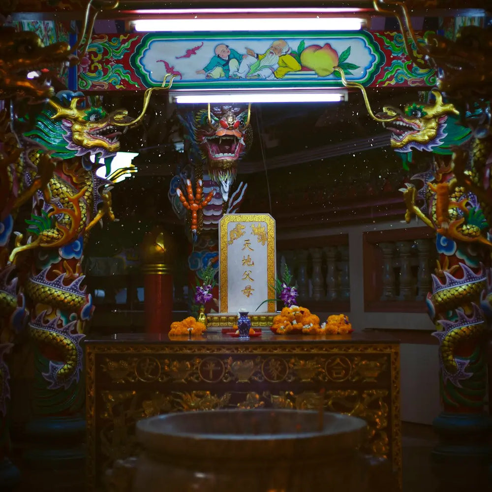 A shrine with a statue in the middle of it - Photo by Alexia Yver on Unsplash