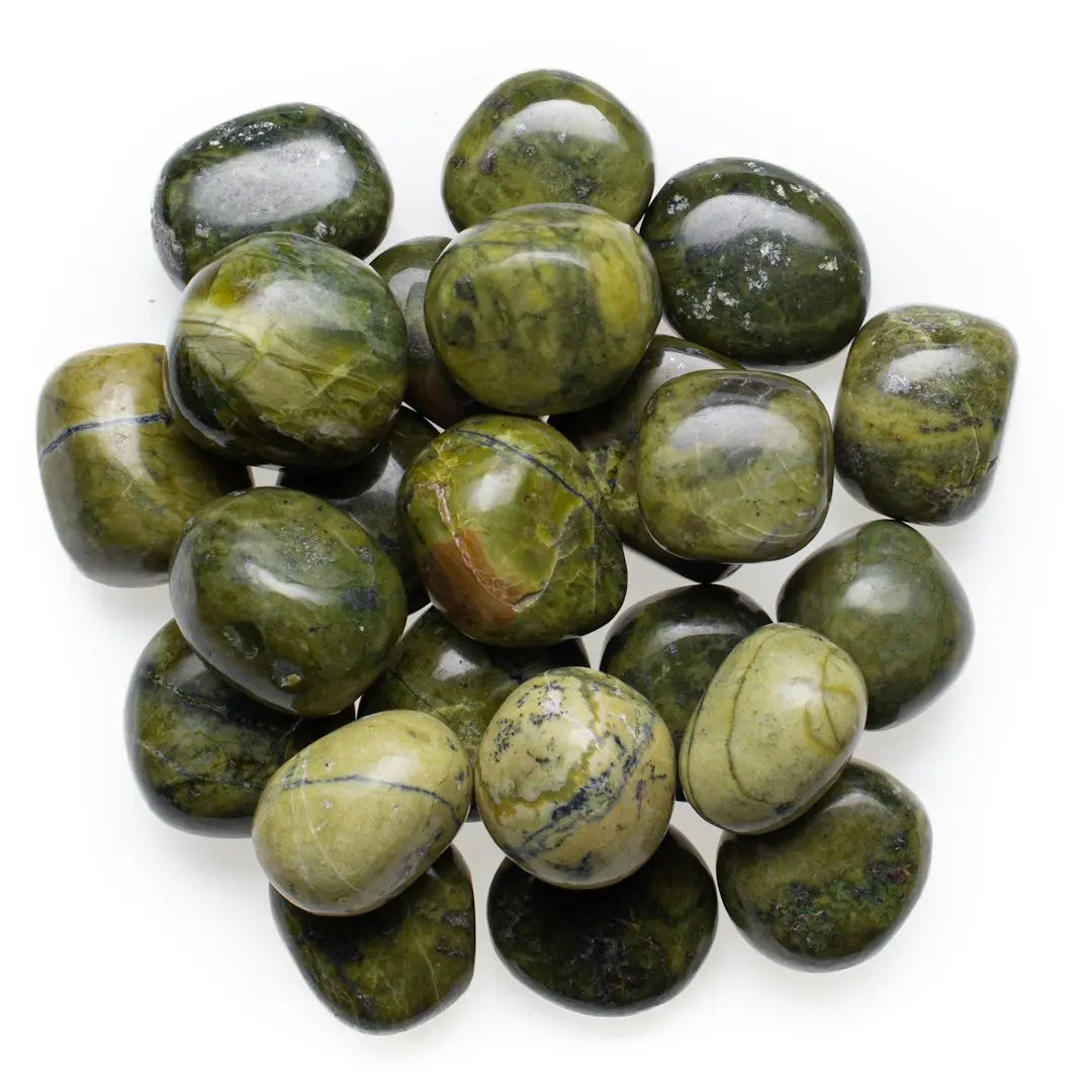 green and black round fruits - Photo by benjamin lehman on Unsplash