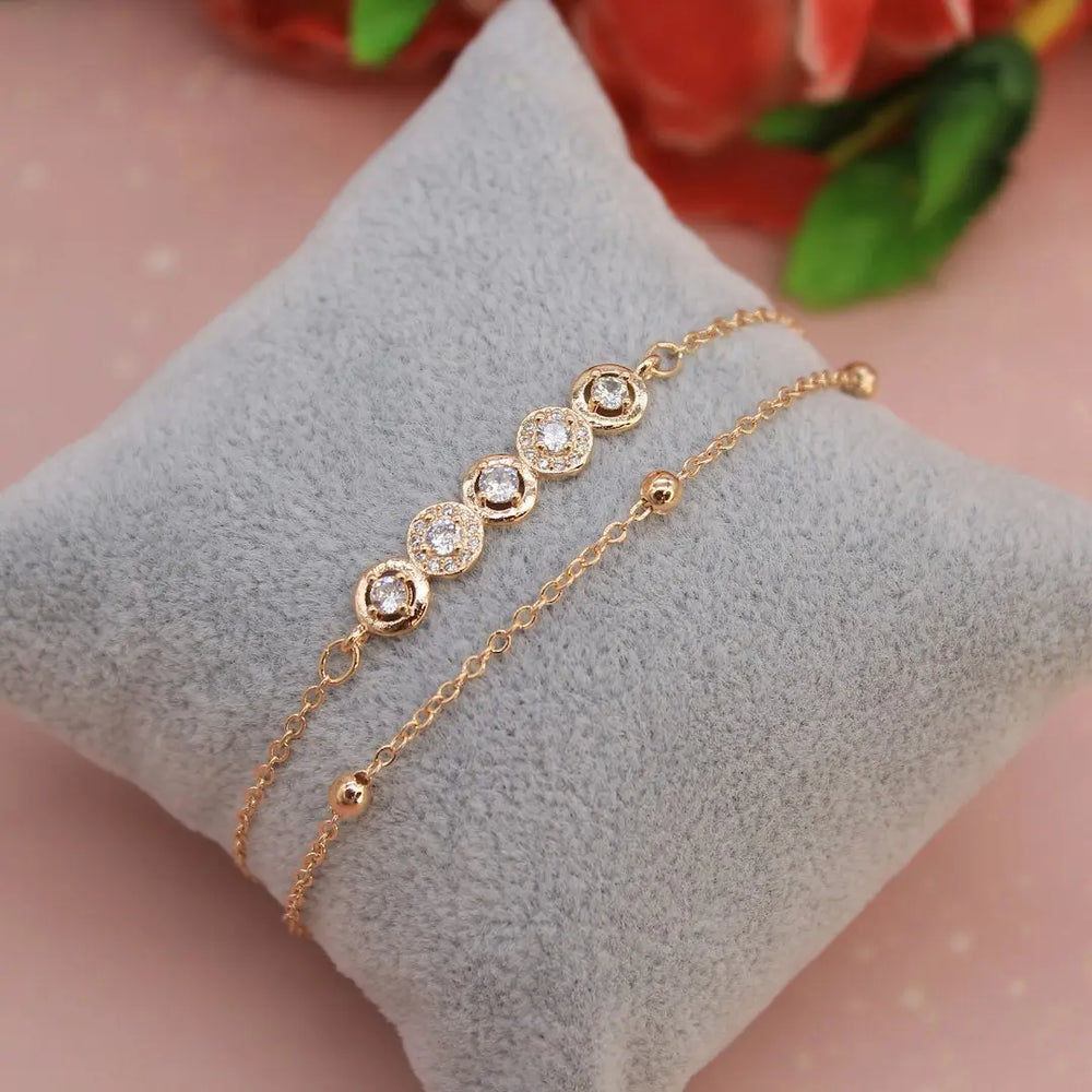 a close up of a bracelet on a pillow - Photo by mansi shah on Unsplash