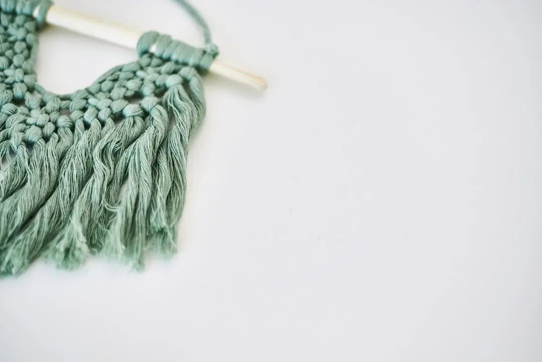 gray yarn on white surface - Photo by Elena Putina on Unsplash