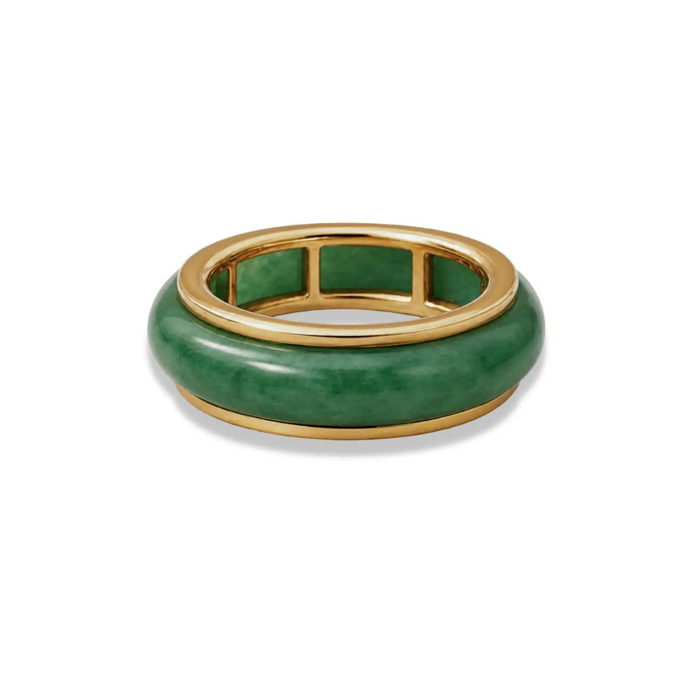 Green jade ring with gold band on a white background