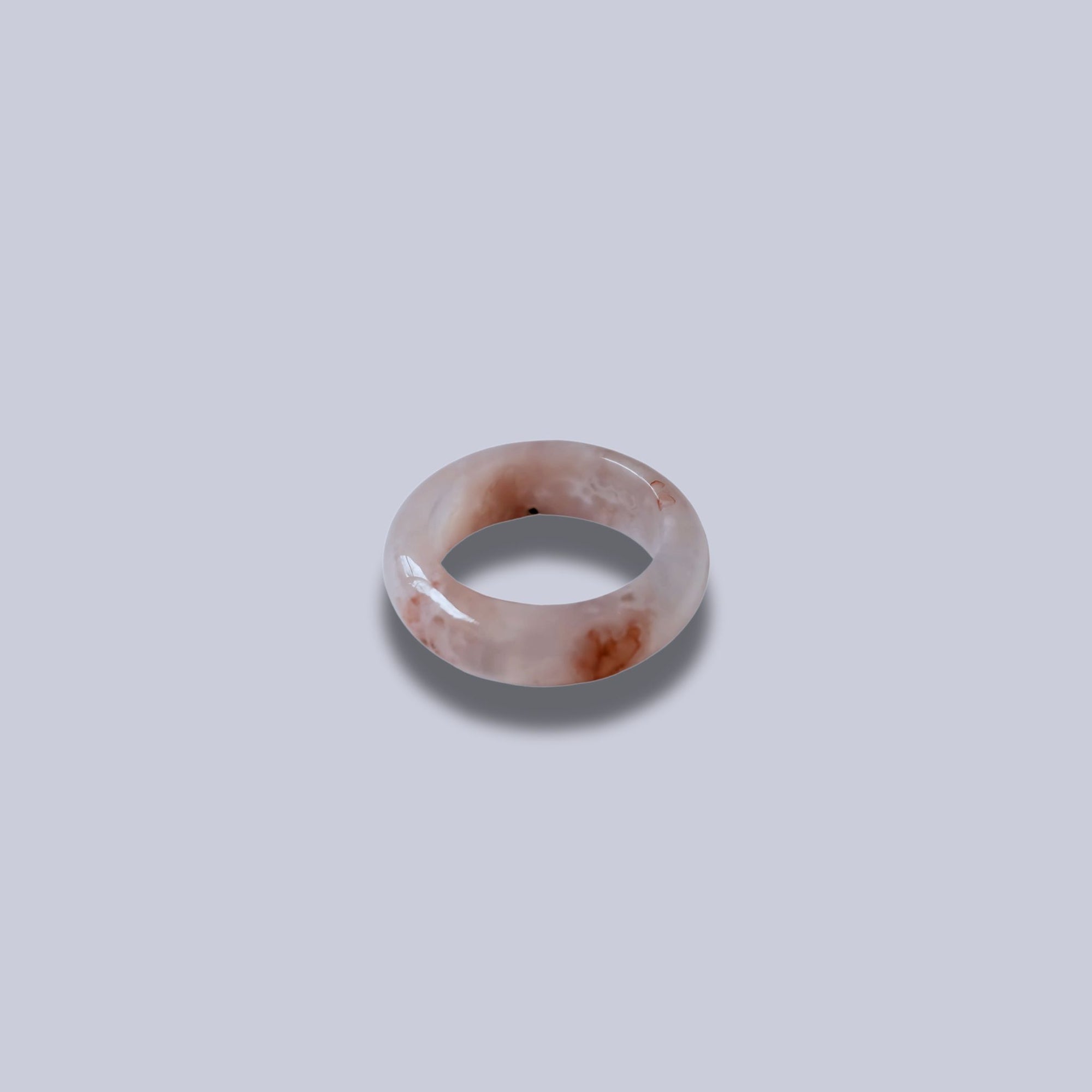 Flower agate ring with soft pink and white patterns on green background