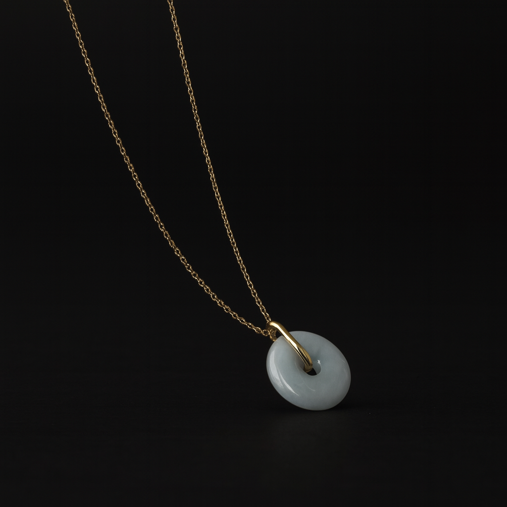 Necklace with a jade pendant on a black background