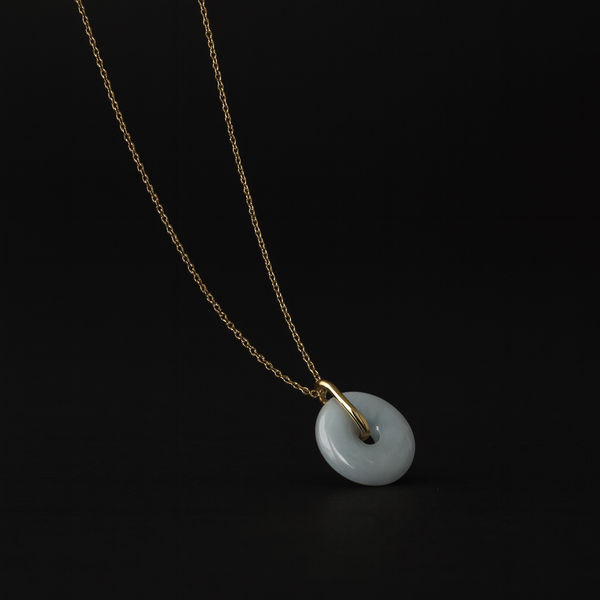 Necklace with a jade pendant on a black background