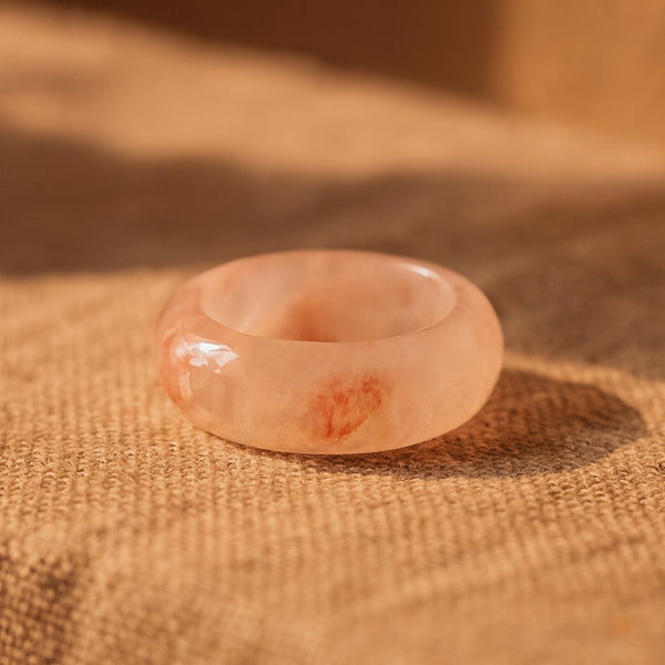 Flower agate ring with soft pink and white patterns on green background