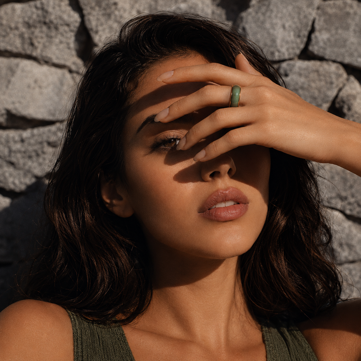 Model covering face with jaura ring