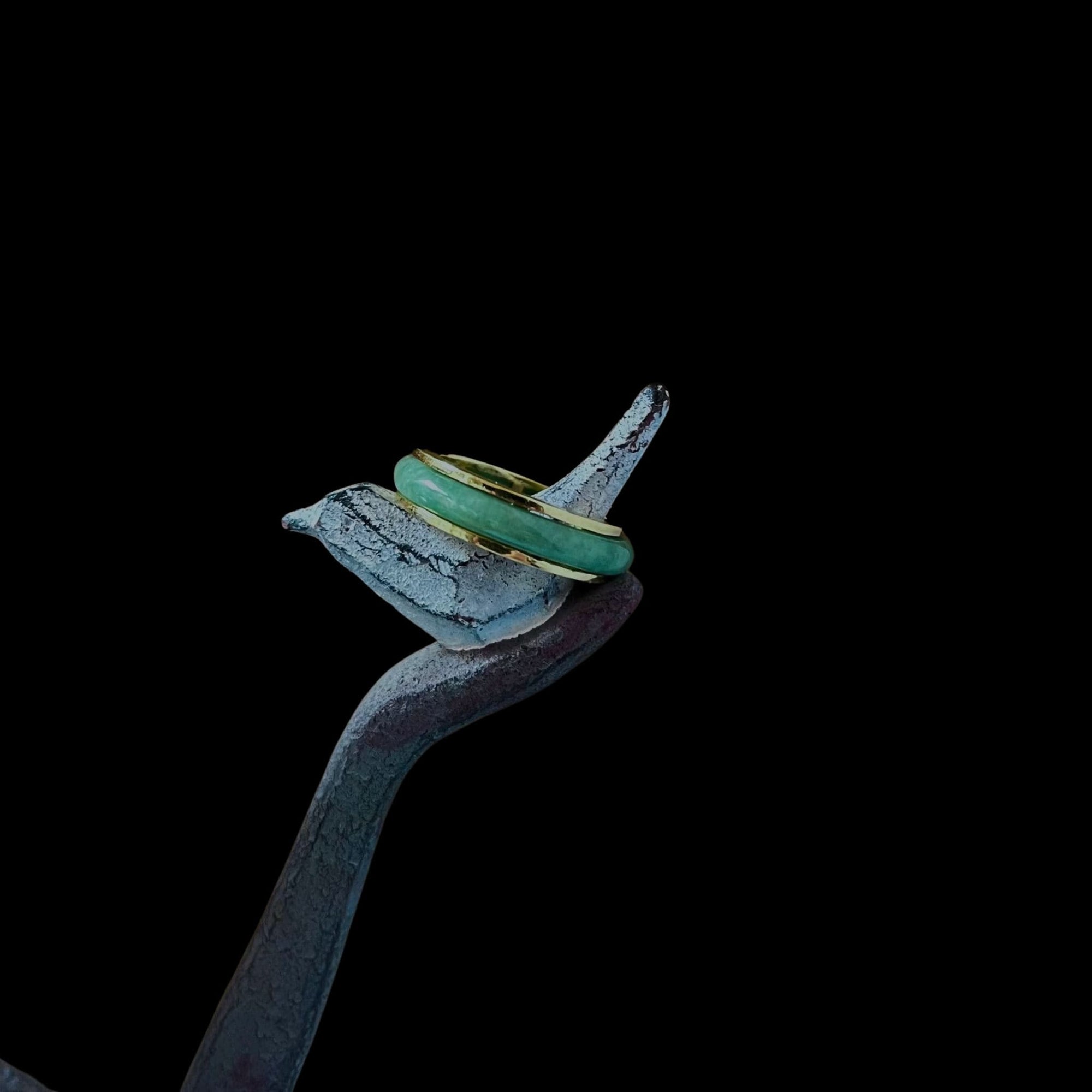 Side angle of the Jaura Ring showing thickness of gold band and setting of jadeite.