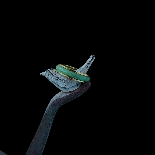 Side angle of the Jaura Ring showing thickness of gold band and setting of jadeite.