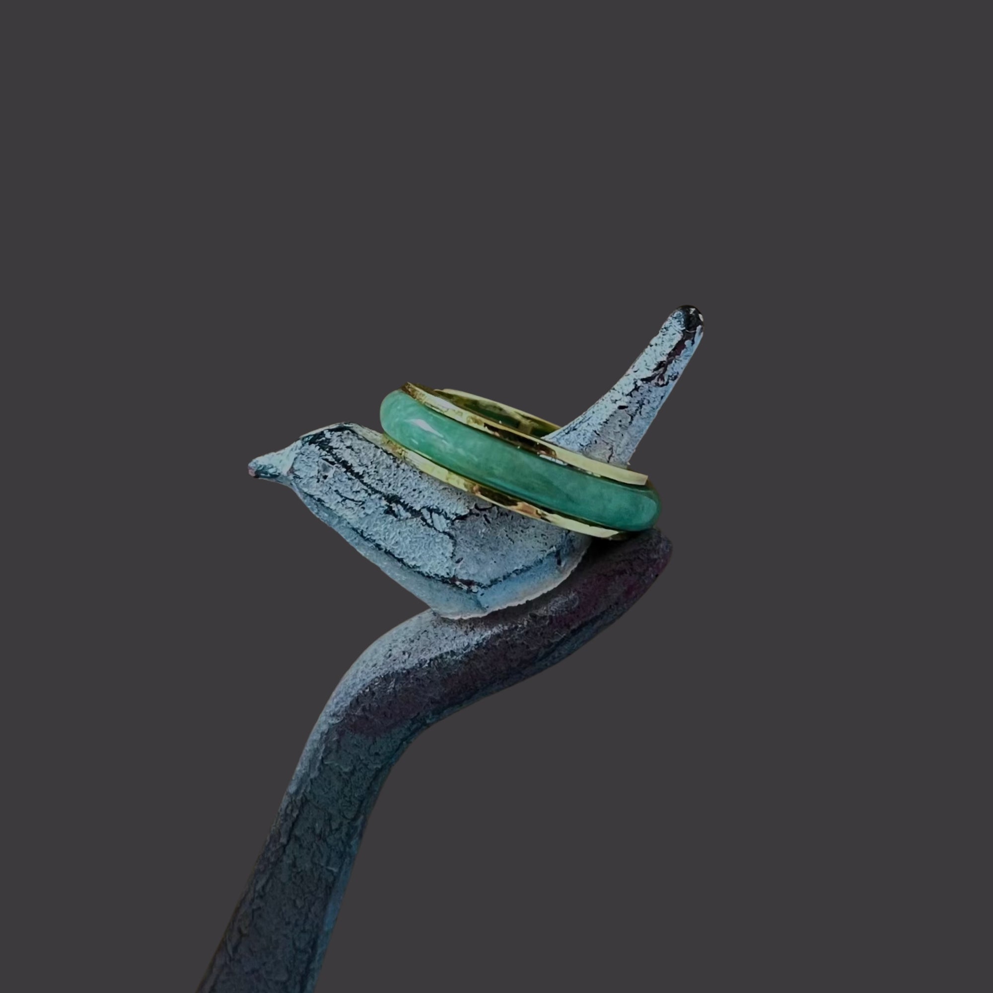 Side angle of the Jaura Ring showing thickness of gold band and setting of jadeite.