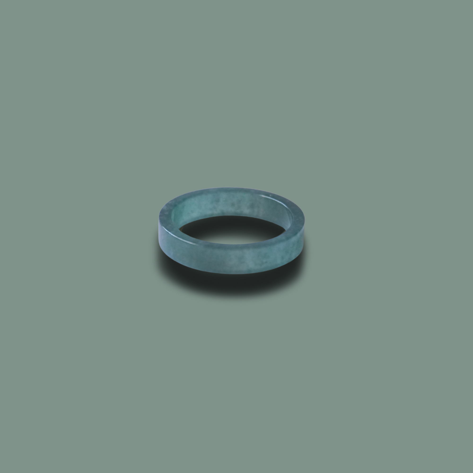 The Seren Jade Ring — a minimalist flat-profile band hand-carved from natural jadeite, showcasing smooth texture and modern elegance for daily wear or stacking.
