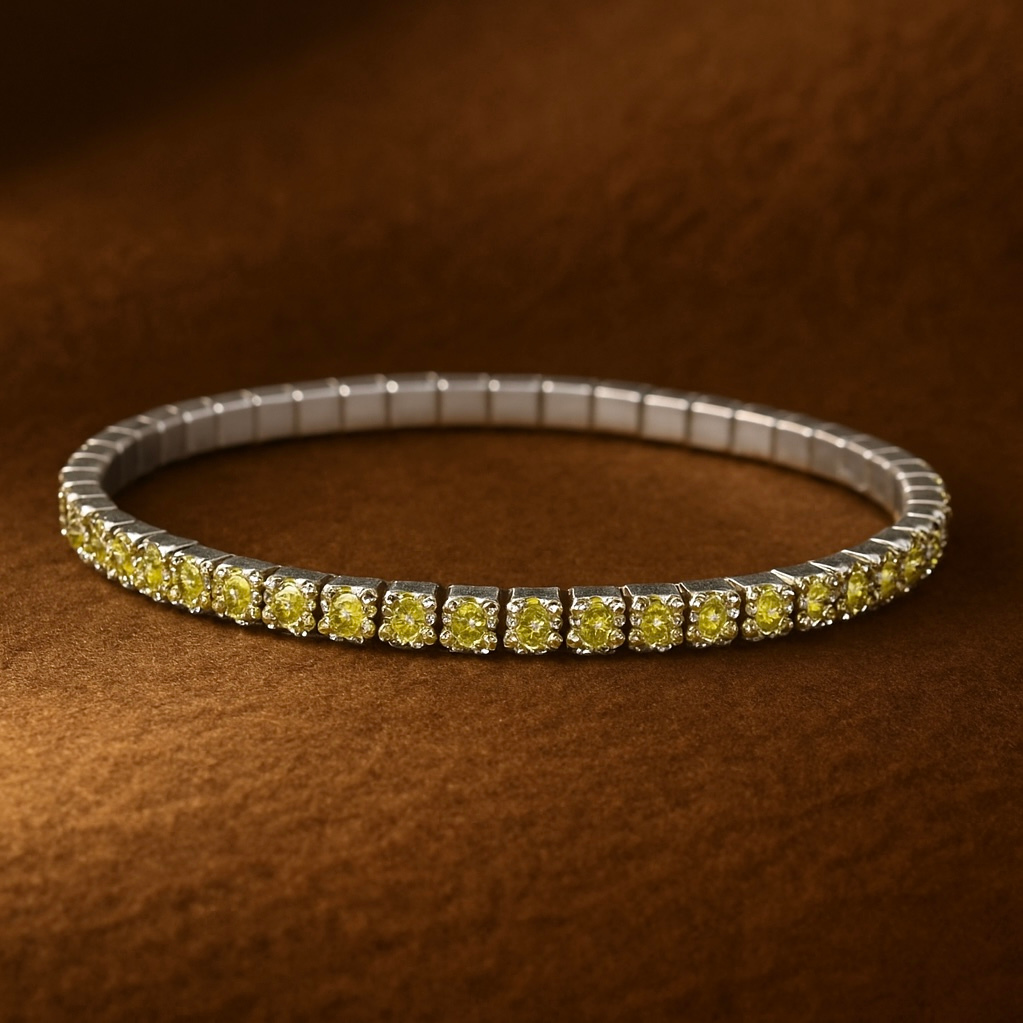 Silver bracelet with yellow gemstones on a brown textured background