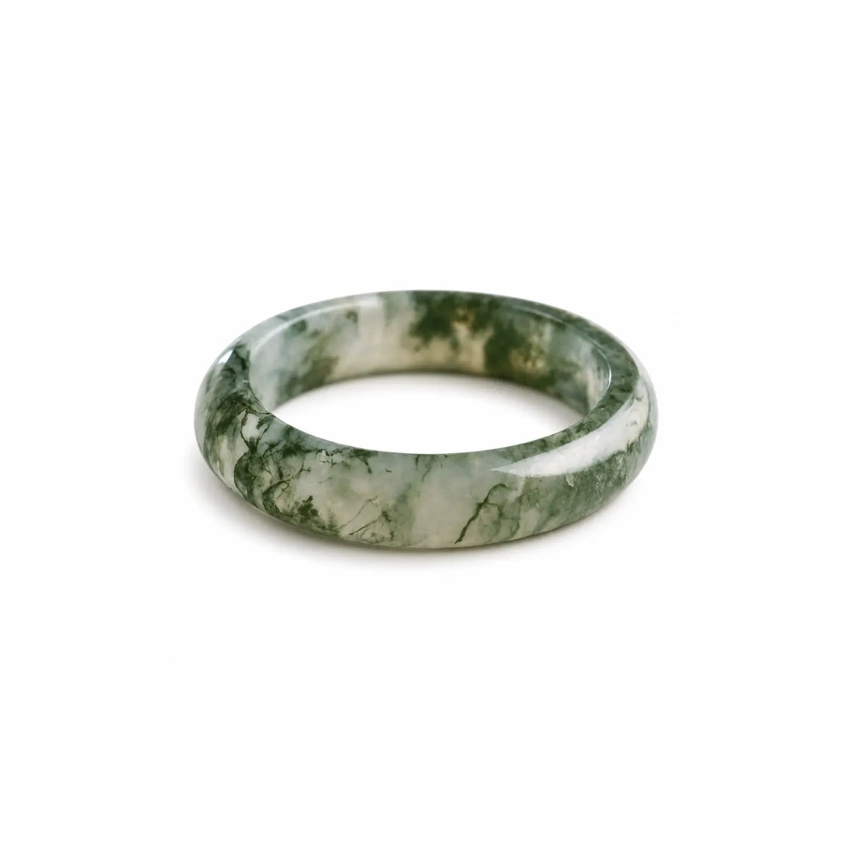 Hand-carved Somae Moss Agate Ring with natural green inclusions, minimalist round band displayed on neutral background.