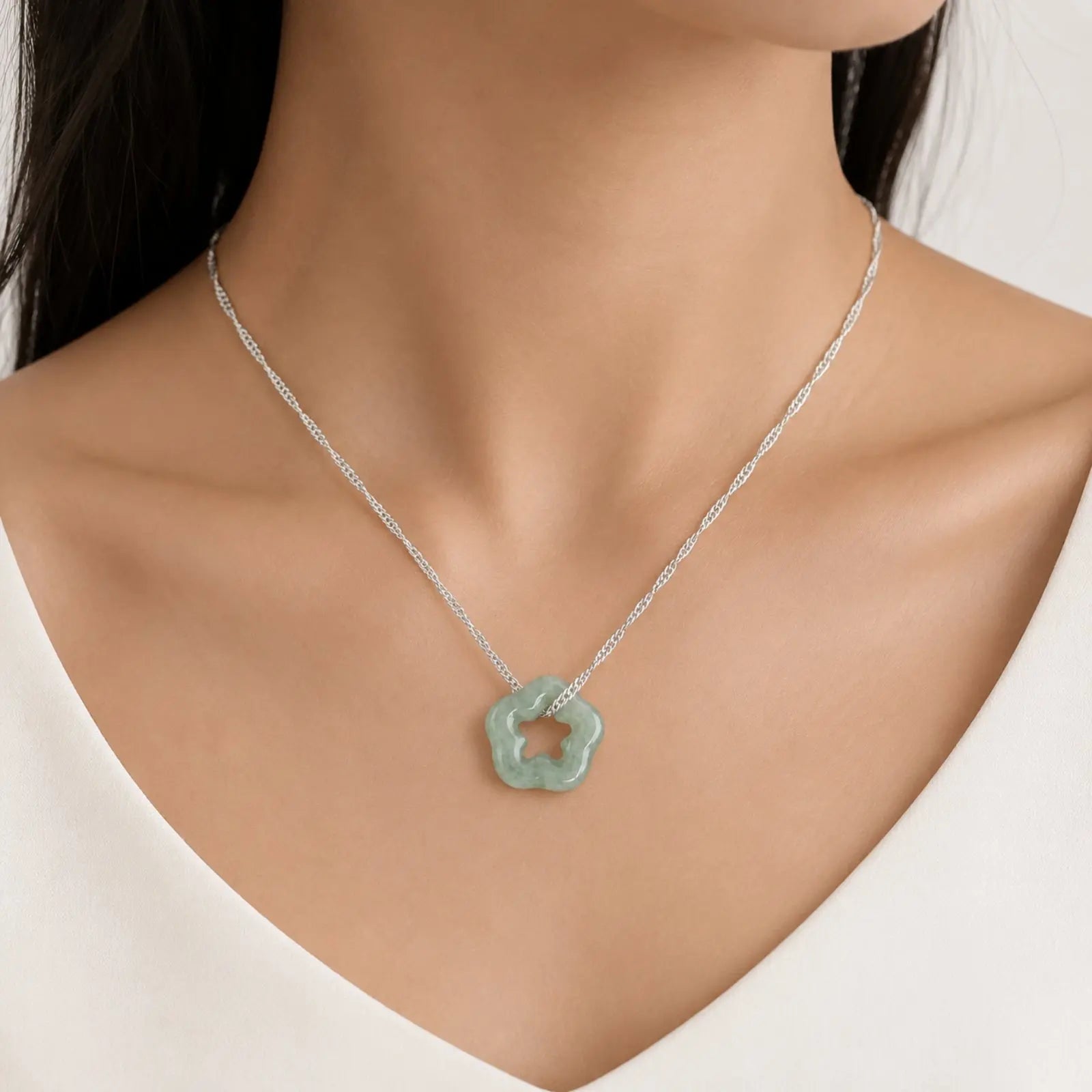 Necklace with a green pendant on a mannequin