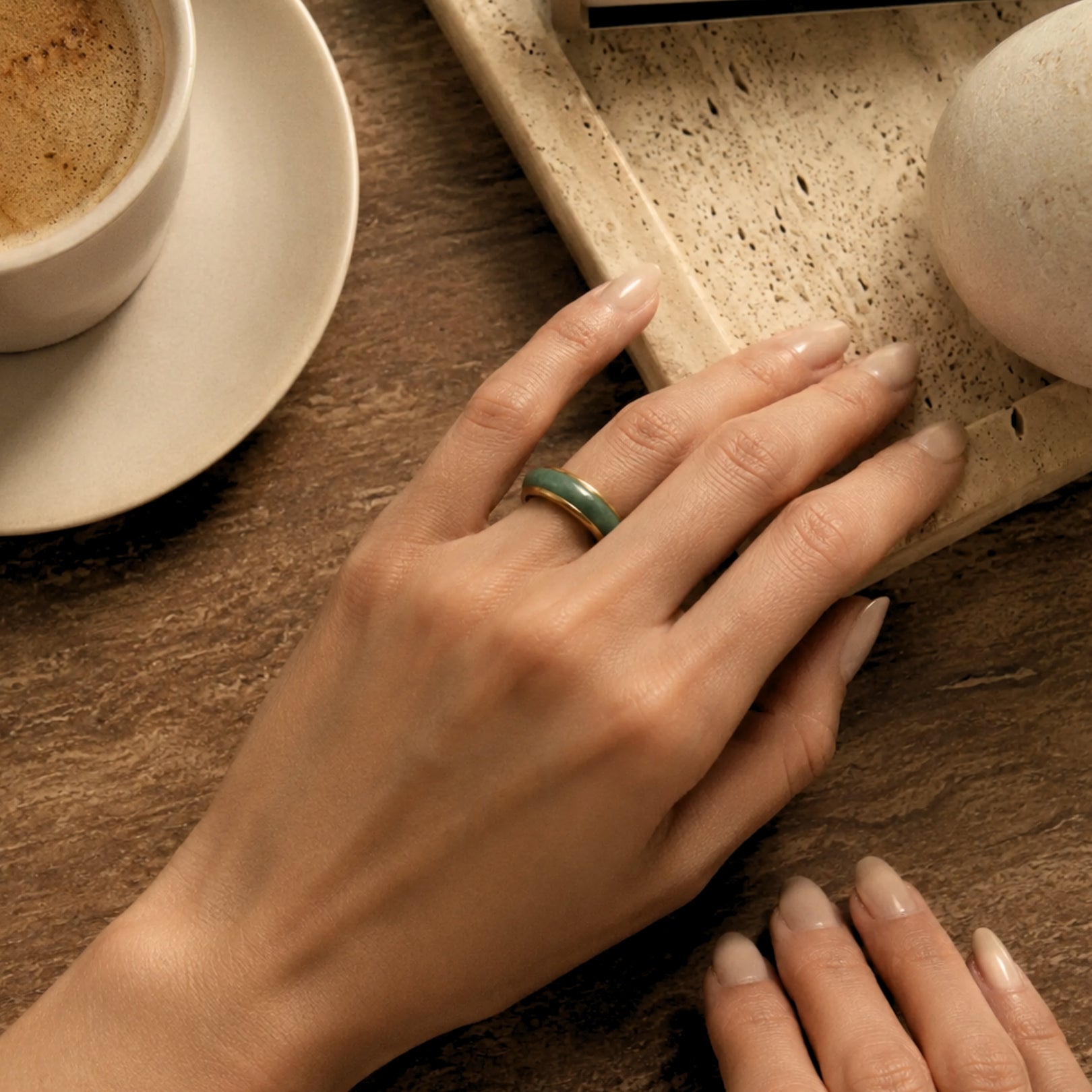 Jaura ring on fingers over coffee